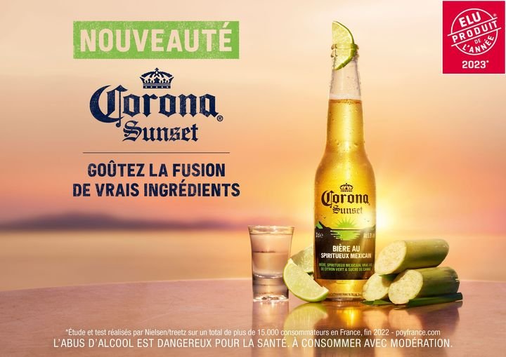 Bouteille de Corona Sunset fraîche, parfaite pour un moment de détente avec ses saveurs fruitées et son goût exotique